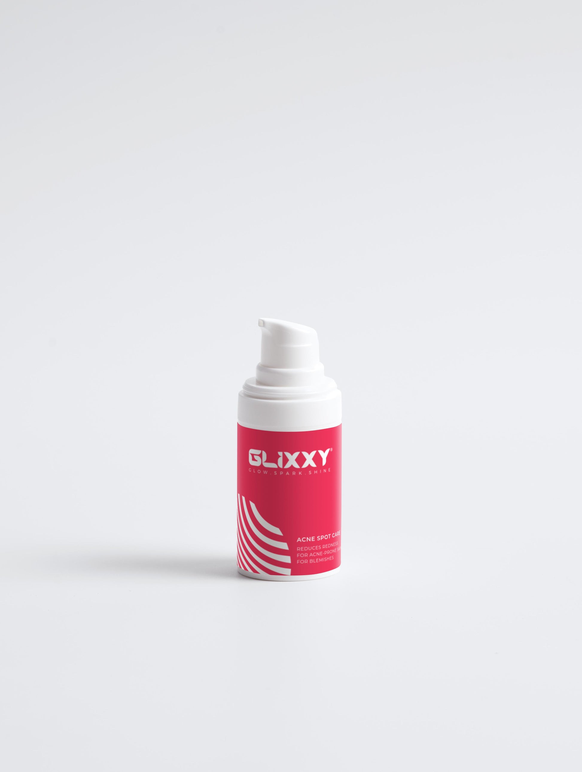 Glixxy skincare bottle on a white background in acne spot care collection box