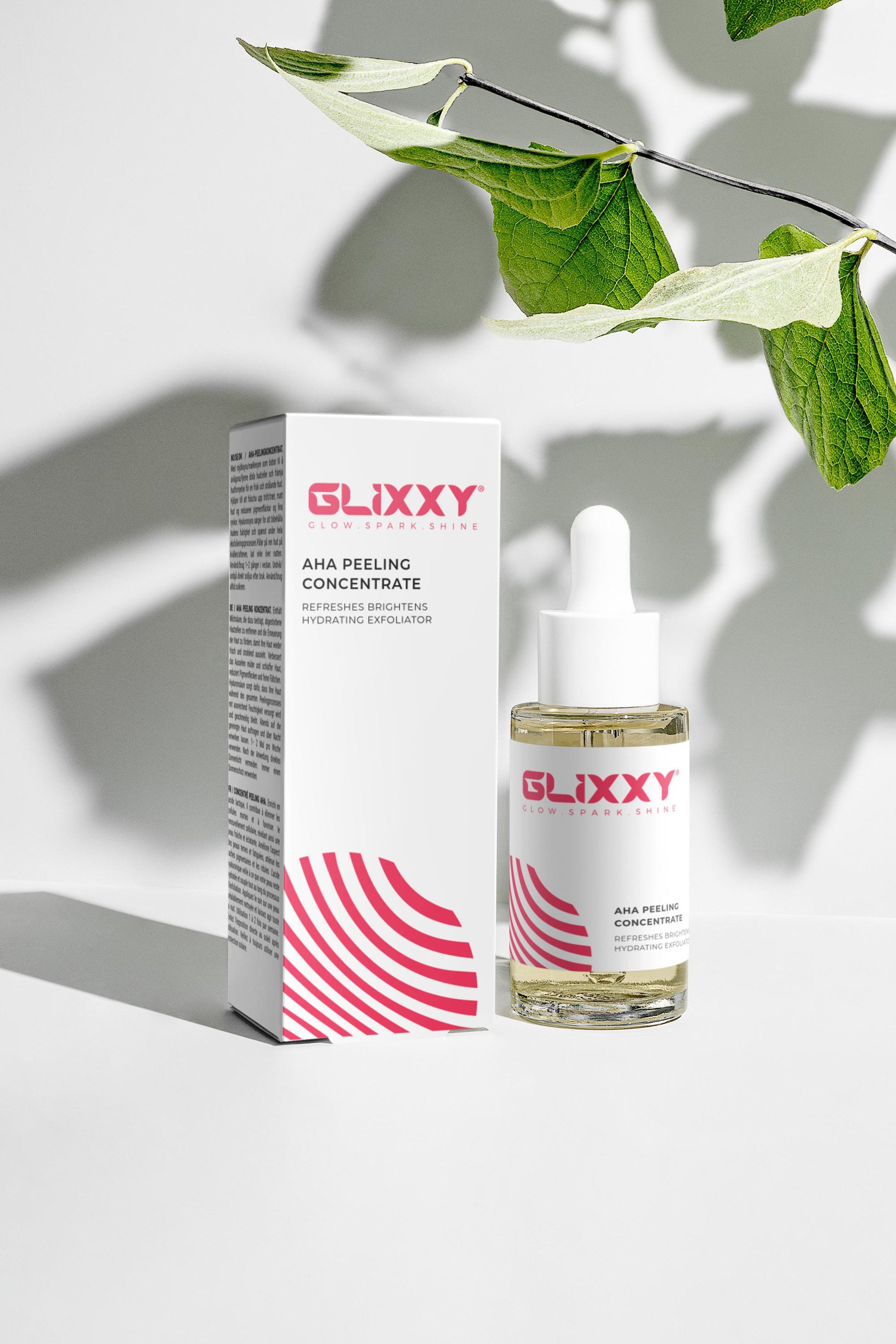 Glixxy skin care product AHA Peeling Concentrate with packaging on a light background