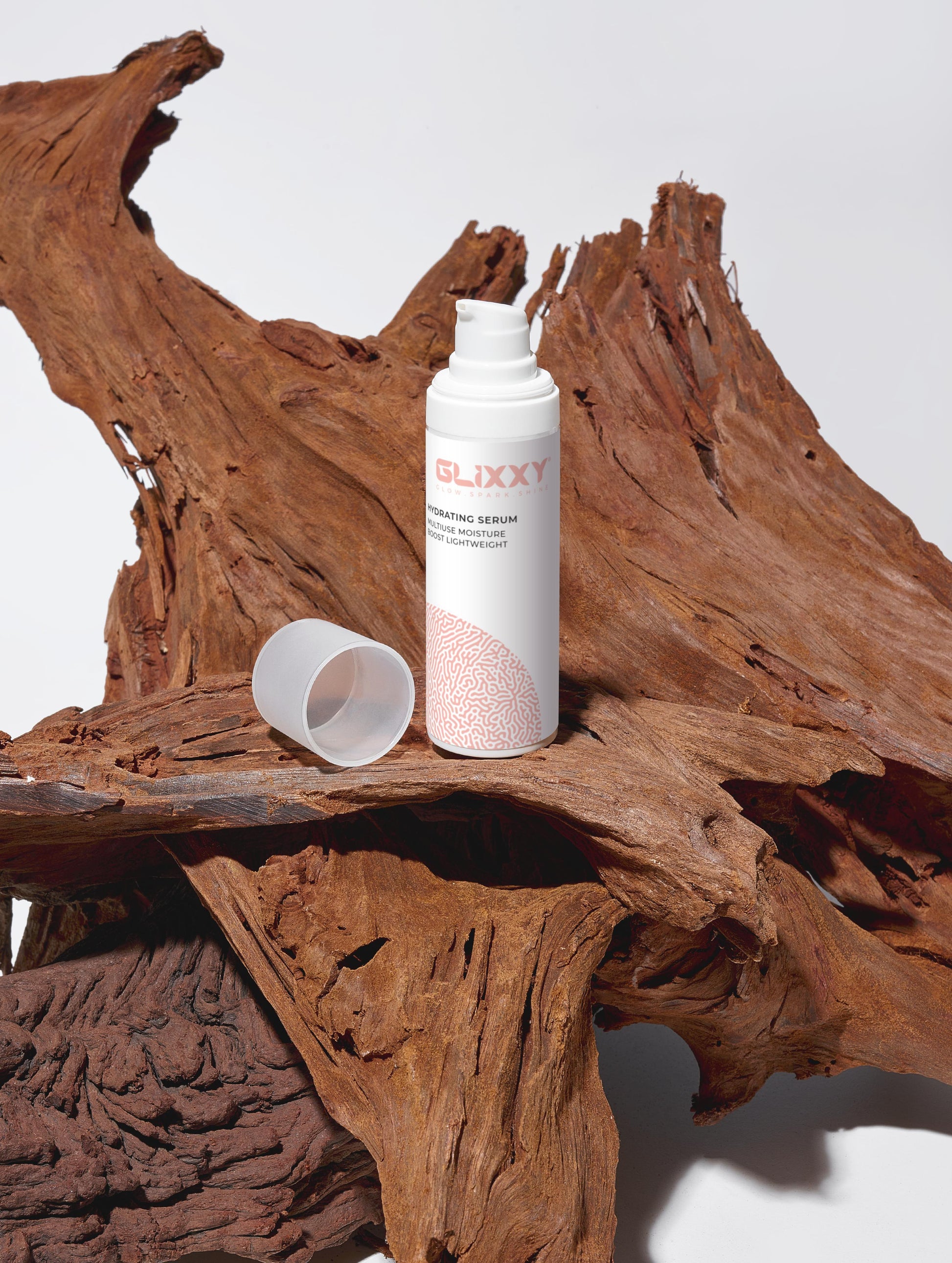 Glixxy bottle with cap on a wooden surface