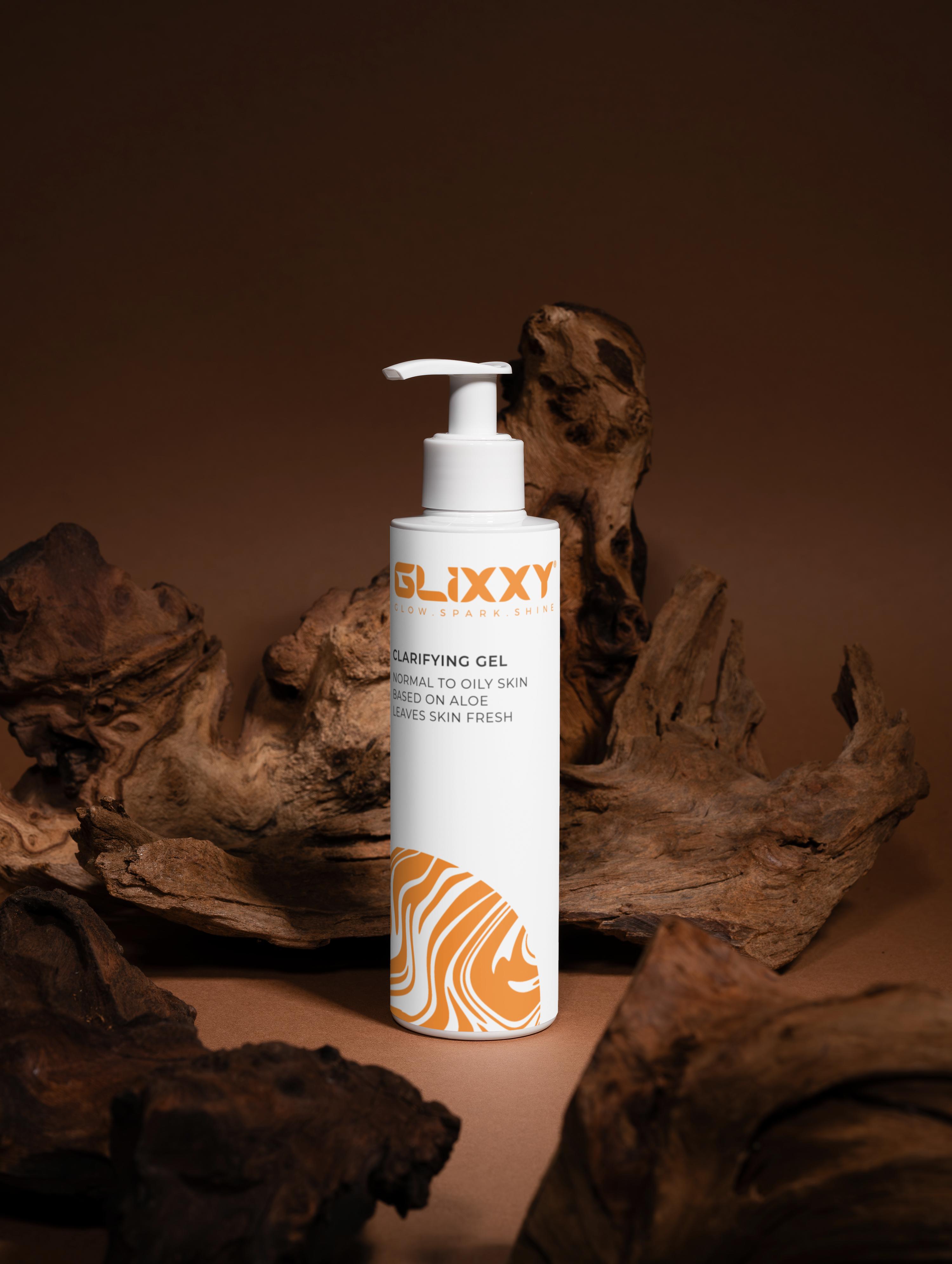 Glixxy clarifying gel bottle with natural wood background