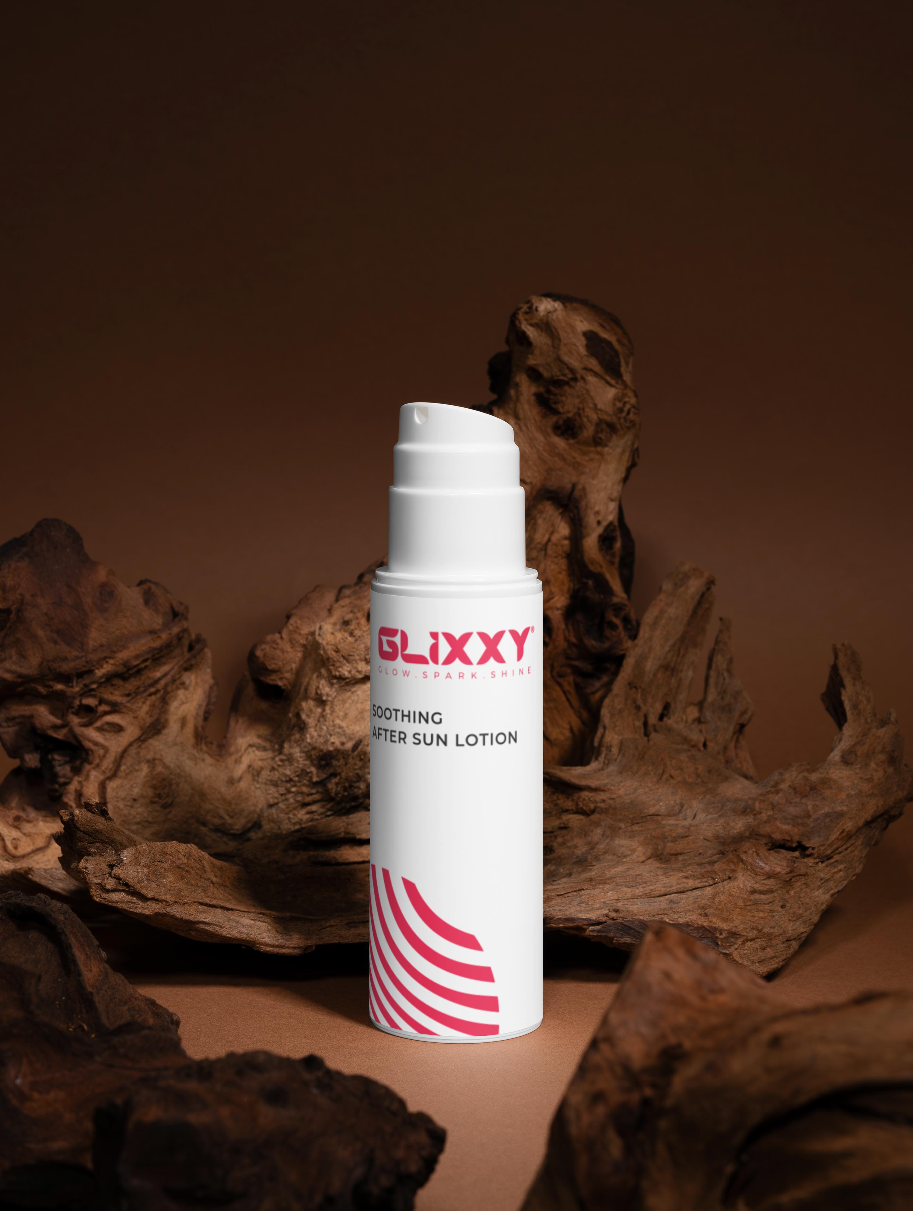 Glixxy after sun lotion bottle on a brown background with natural elements