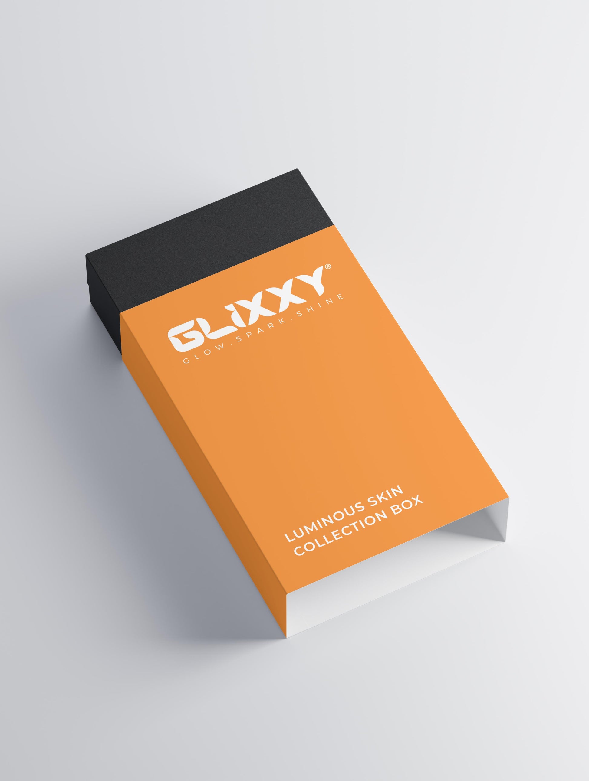 Orange and black Glixxy packaging on a light gray background