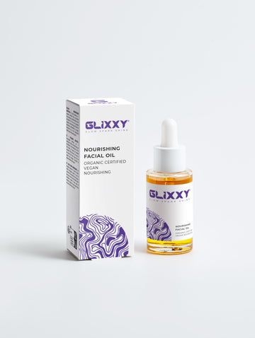 Glixxy nourishing facial oil bottle and packaging on a white background