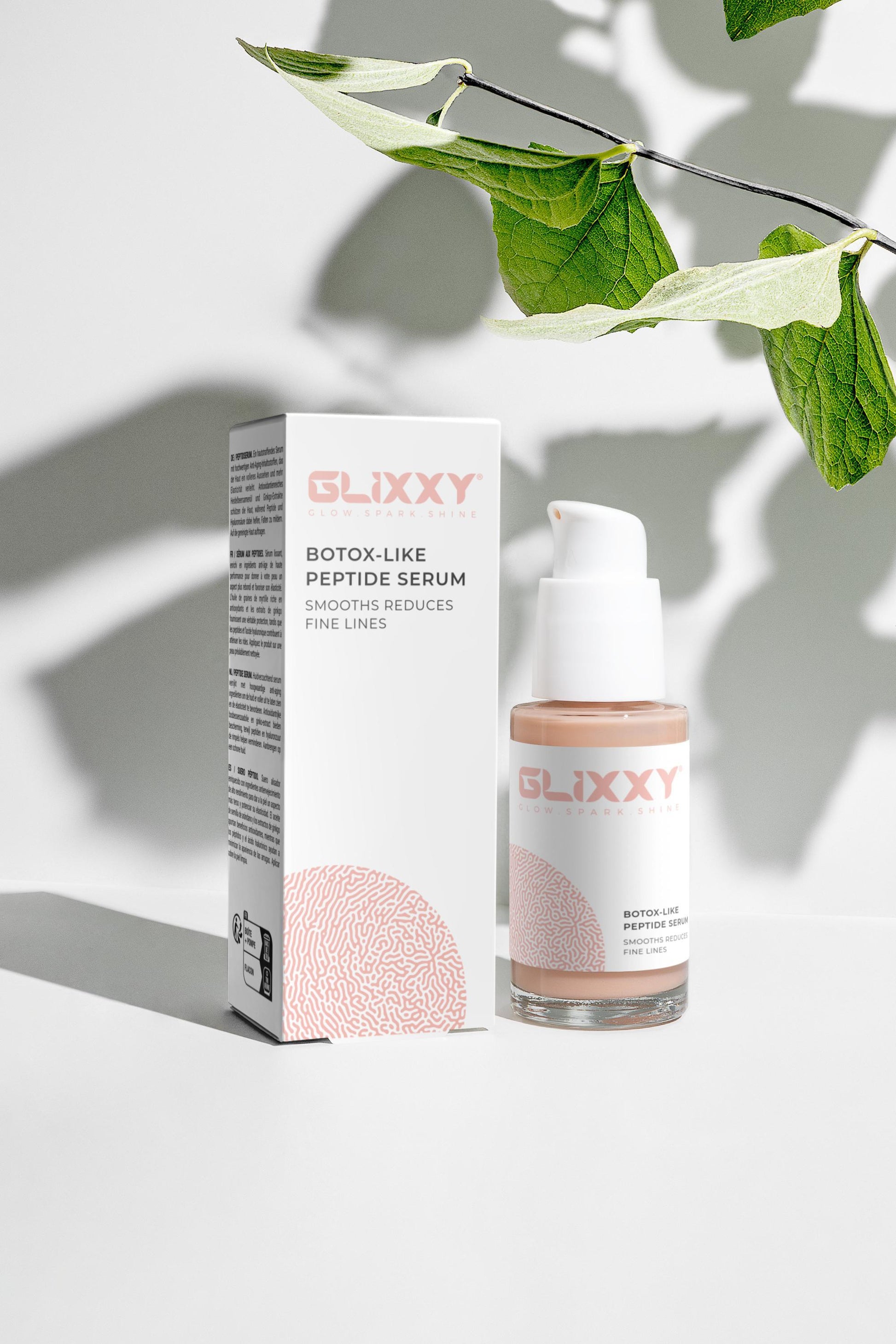 Glixxy botox-like peptide serum with packaging on a light background