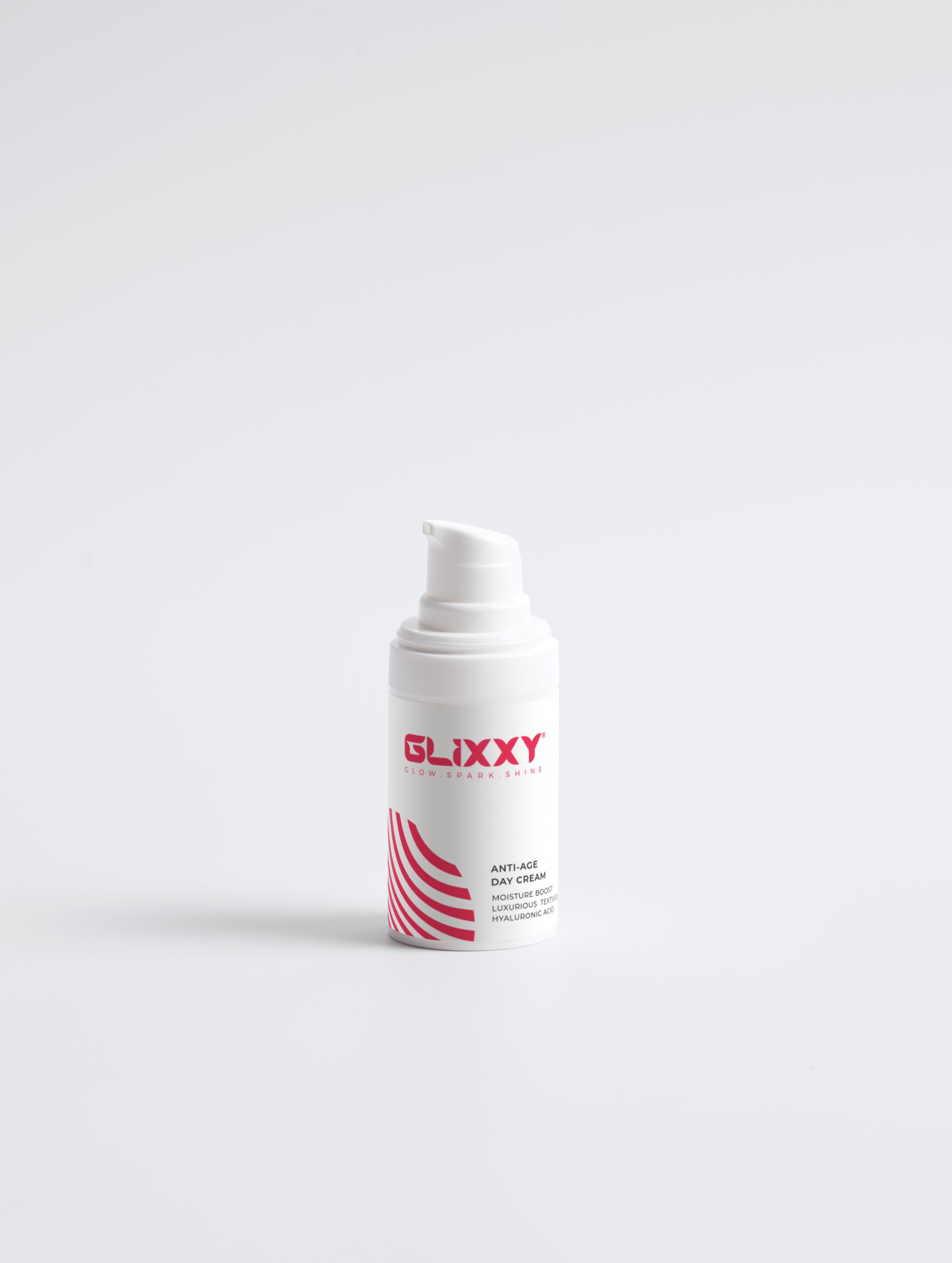 White cosmetic bottle with red and black text on a white background