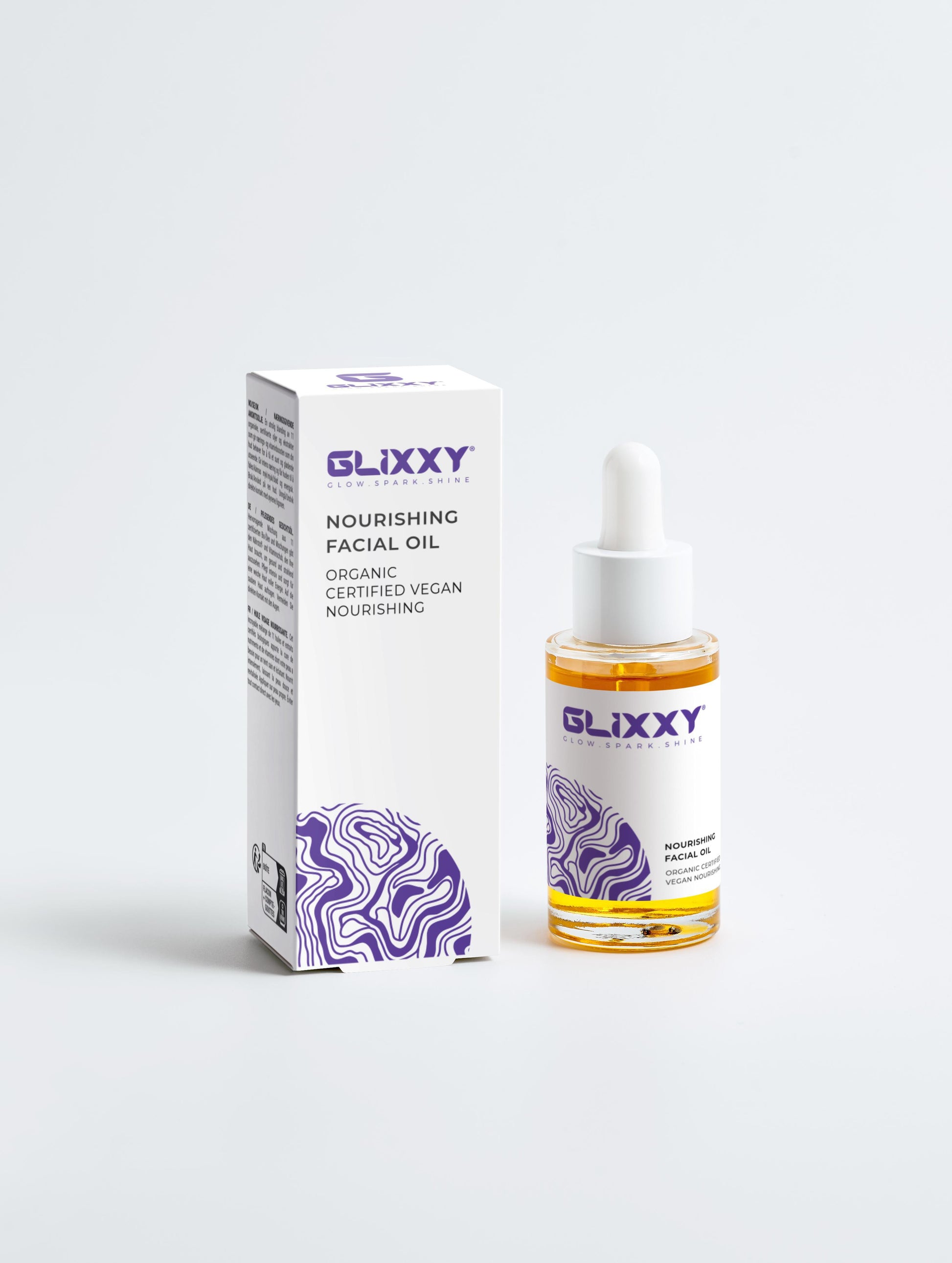Glixxy nourishing facial oil bottle and packaging on a white background