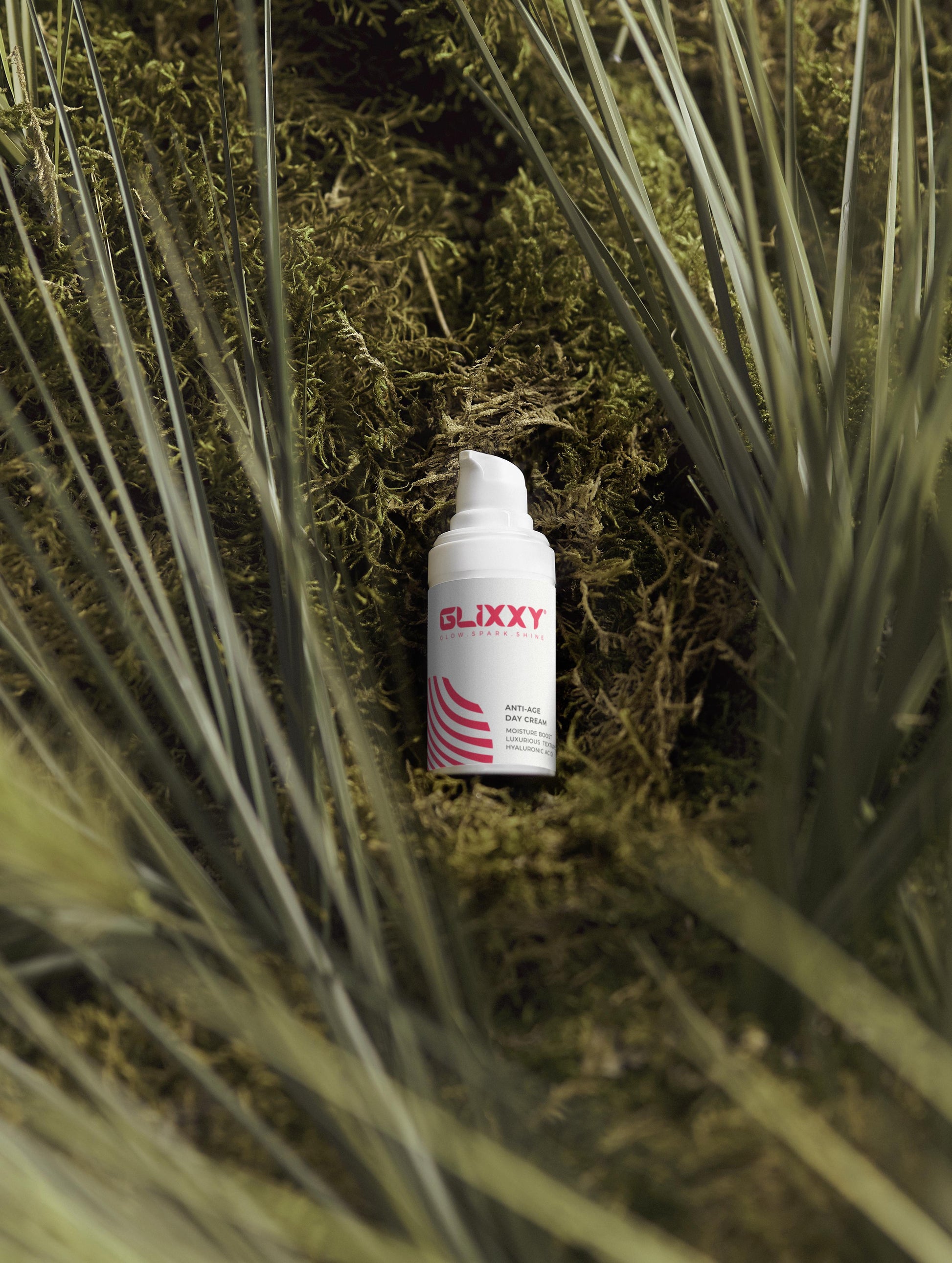 Slixxy spray bottle in a grassy area