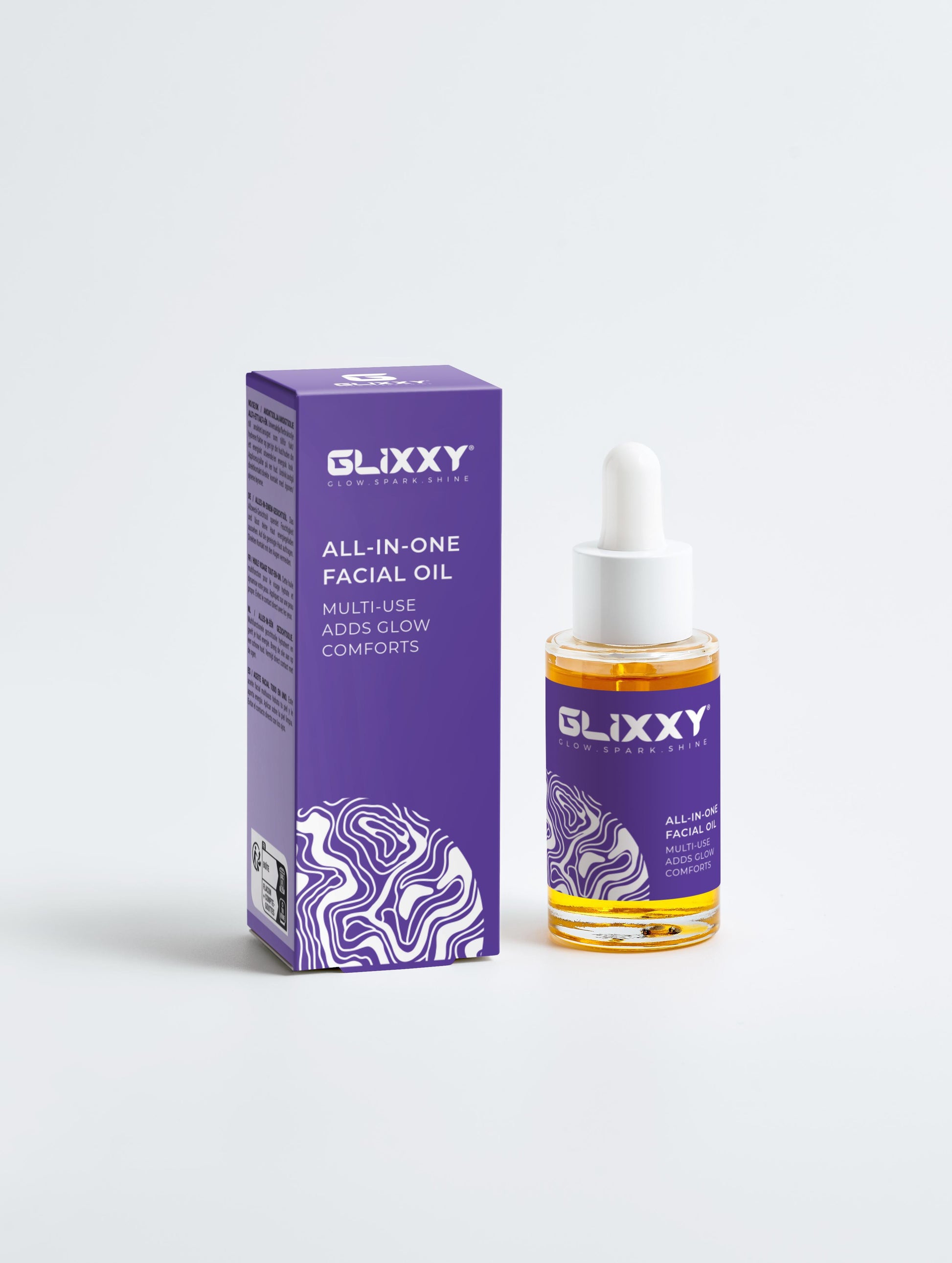 Glixxy all-in-one facial oil with packaging on a white background