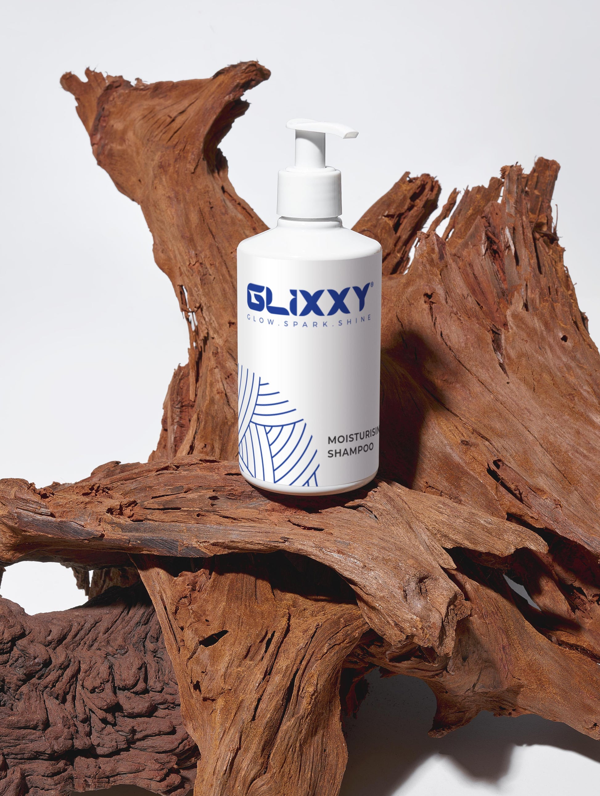 Glixxy best moisturising shampoo for fine hair bottle on a wooden surface