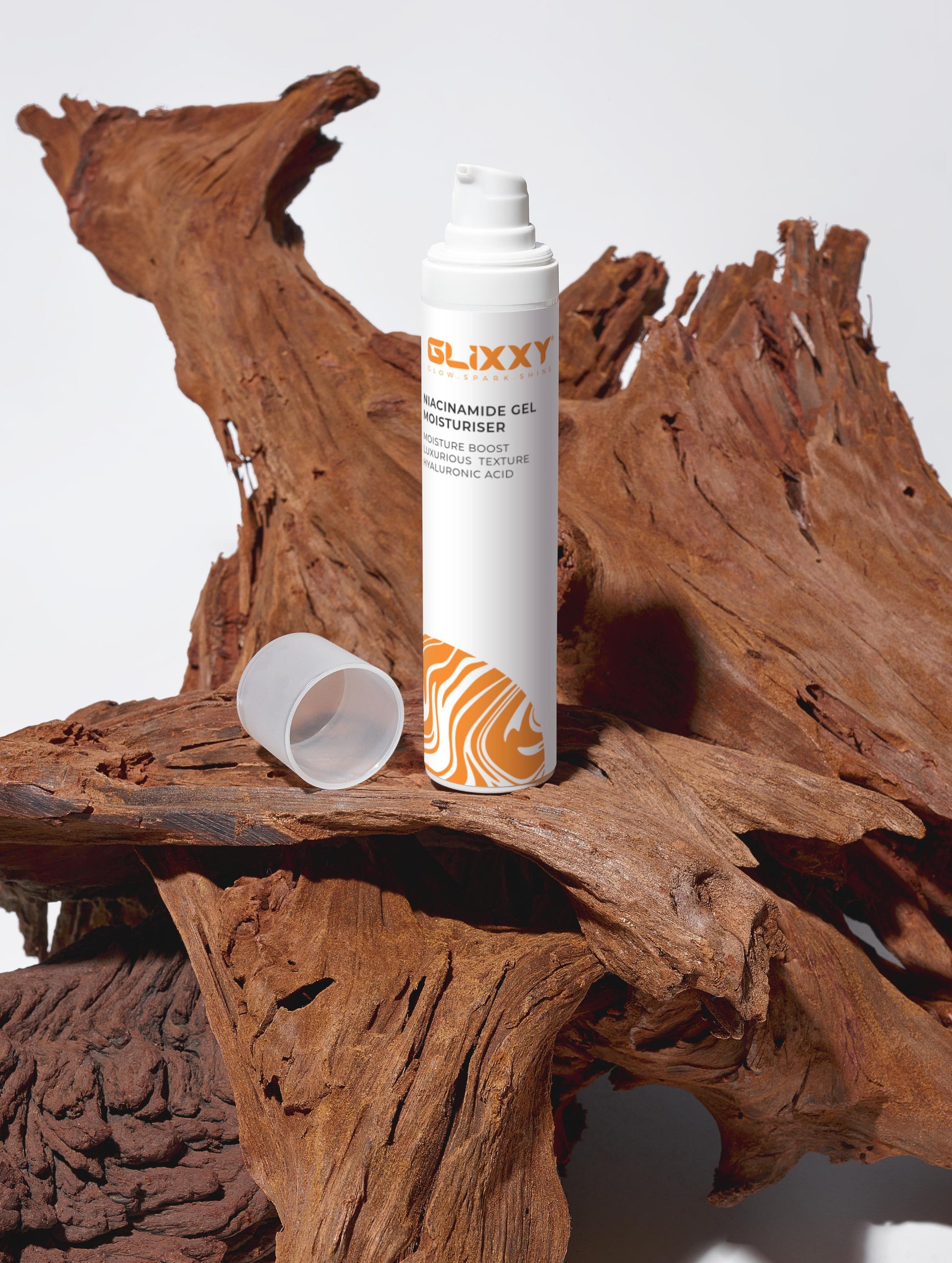 Glixxy best niacinamide gel product can on a wooden surface with a white background