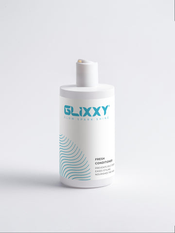 Glixxy fresh conditioner bottle on a light gray background